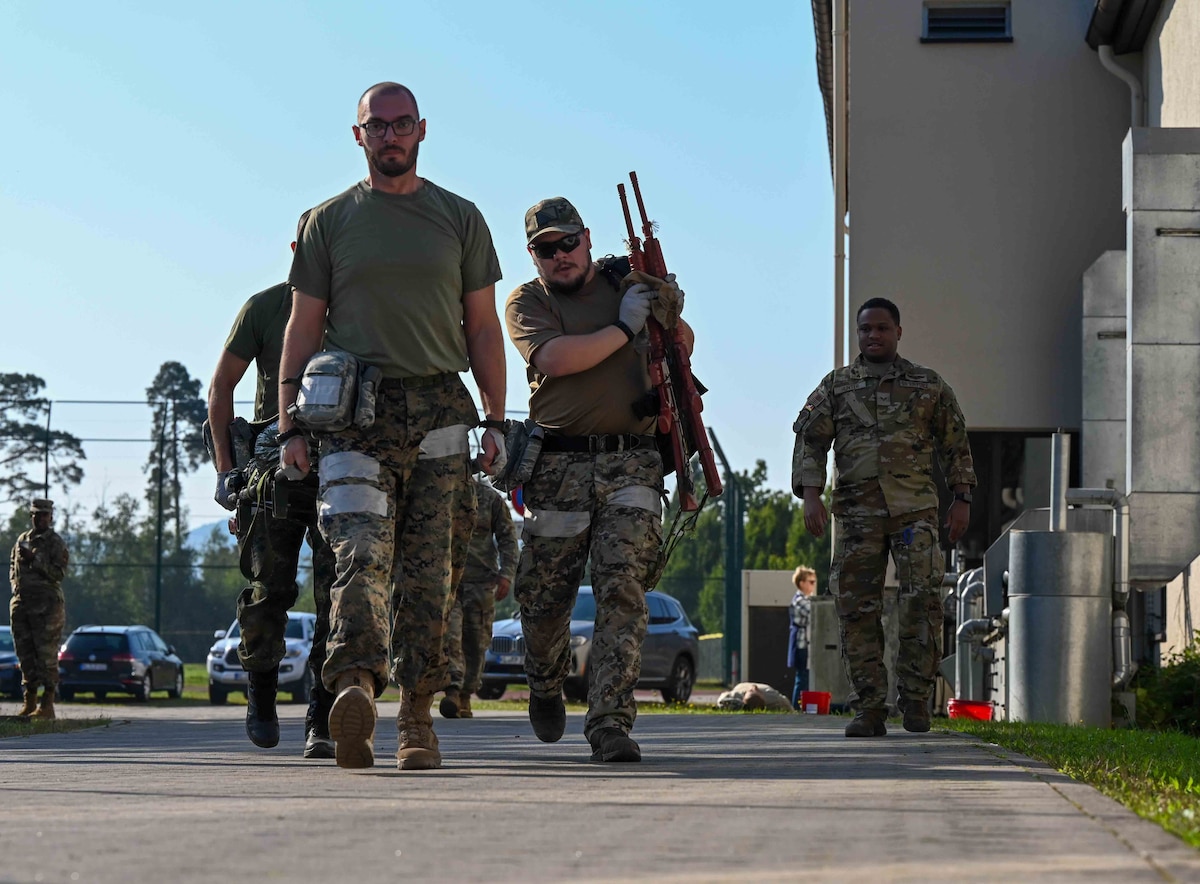 Participants of the European Role 1 Development week transport a simulated casualty for medical evacuation at Ramstein Air Base, Germany, Sept. 19, 2024. The United States Air Forces in Europe - Air Forces Africa Office of the Command Surgeon hosted this engagement to ensure unified medical preparedness and mission readiness across the European theater. (U.S. Air Force photo by Airman 1st Class Dylan Myers)