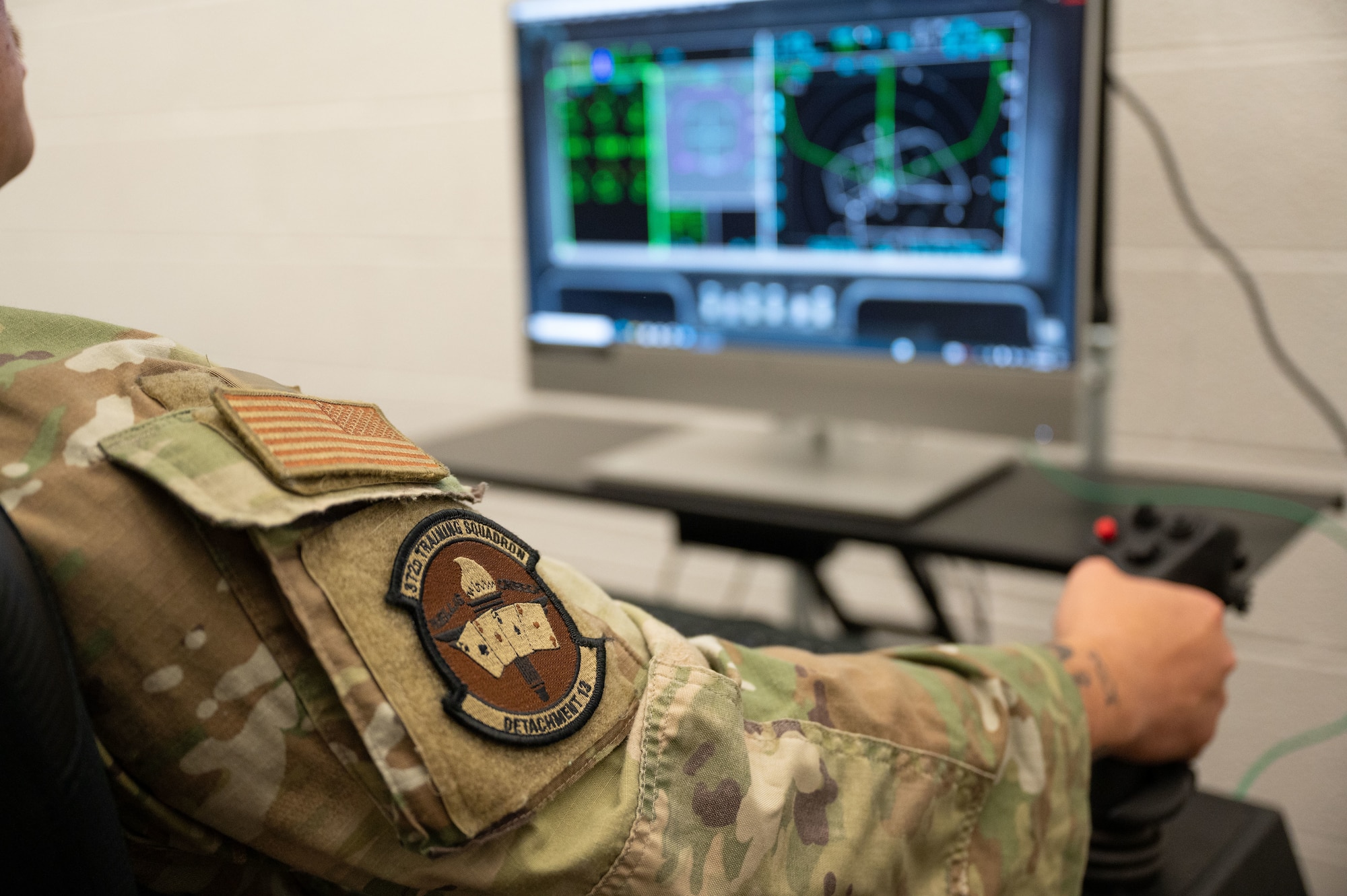 An Airman in an F-35 aircraft maintenance ground