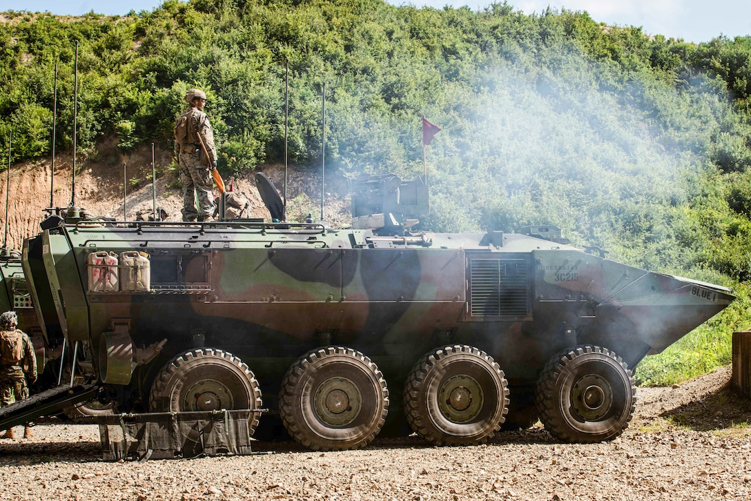 U.S. Marines assigned to Alpha Company, Battalion Landing Team 1/5, 15th Marine Expeditionary Unit, fire a Mark 19 40 mm grenade machine gun mounted to an Amphibious Combat Vehicle during a live-fire, crew-served weapons range with Republic of Korea (ROK) Marines at Suseong-ri, South Korea, Aug. 22, 2024. Integrated training between the two countries strengthens the ROK-U.S. Alliance through bilateral, joint training, contributing toward combined capability in defense of the Korean Peninsula. (U.S. Marine Corps photo by Lance Cpl. Peyton Kahle)