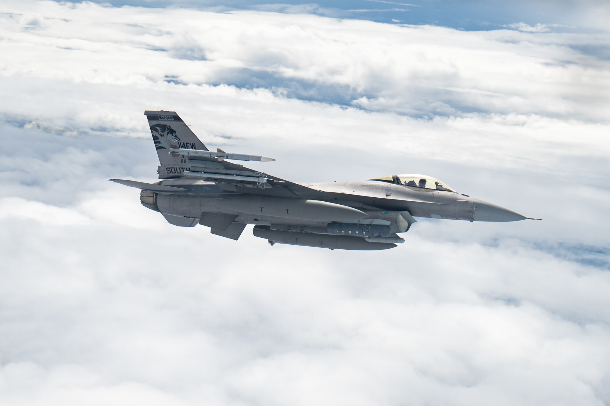 A U.S. Air Force F-16CM Fighting Falcon operated by the 179th Expeditionary Fighter Squadron flies echelon with a KC-135 Stratotanker for aerial refueling during exercise Southern Beach over the Pacific Ocean, Sept. 19, 2024. The Fighting Falcon is renowned for its fly-by-wire system, and exceptionally flexible design, enabling it to excel worldwide in a range of both air-to-air and air-to-ground roles. (U.S. Air Force photo by Senior Airman Tylir Meyer)