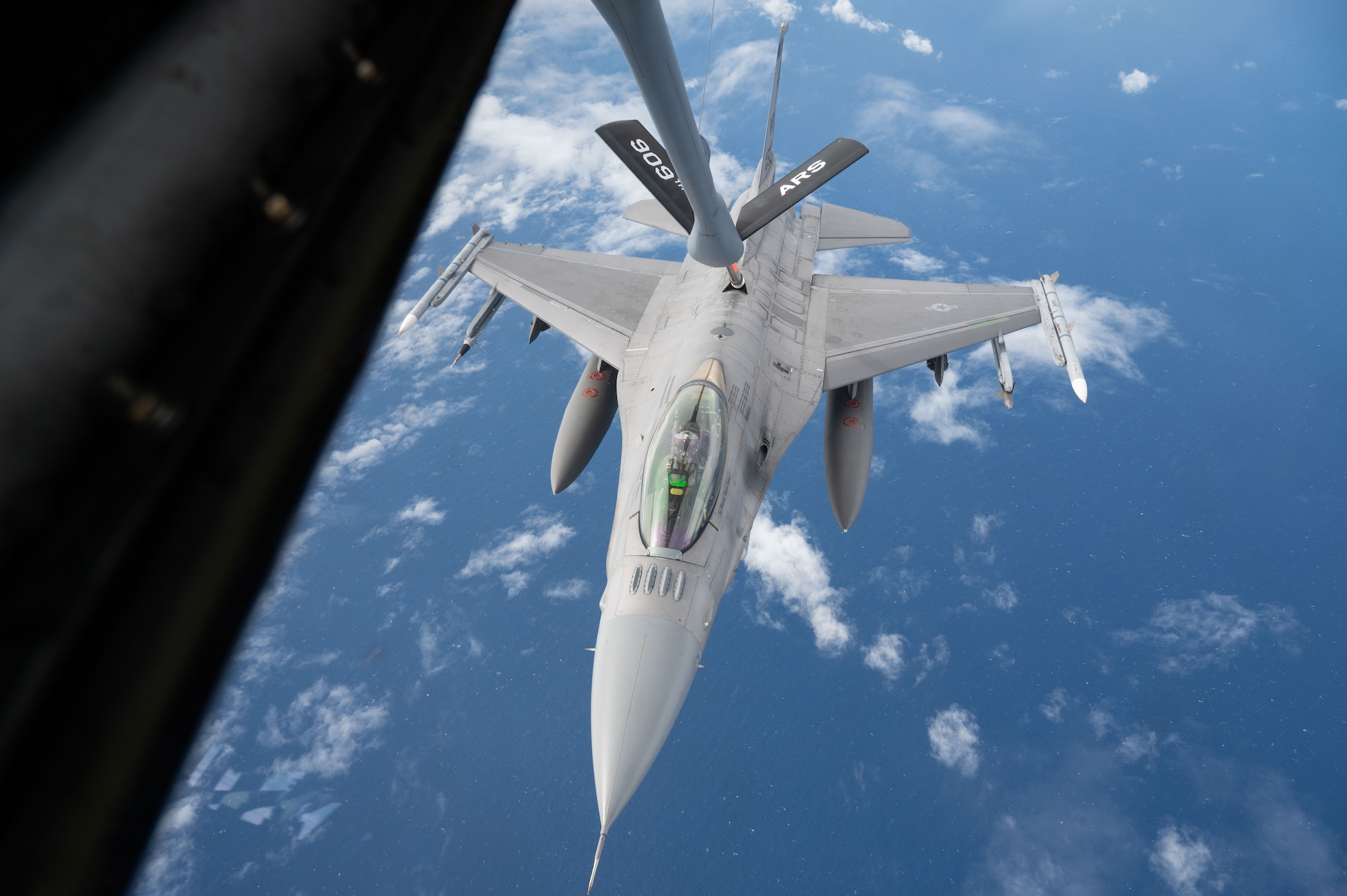 A U.S. Air Force F-16CM Fighting Falcon operated by the 179th Expeditionary Fighter Squadron conducts aerial refueling with a KC-135 Stratotanker during exercise Southern Beach over the Pacific Ocean, Sept. 19, 2024. Kadena Air Base serves as a hub for airpower in the Pacific, ensuring readiness to project force capabilities and provide support to regional allies and partners when called upon. (U.S. Air Force photo by Senior Airman Tylir Meyer)