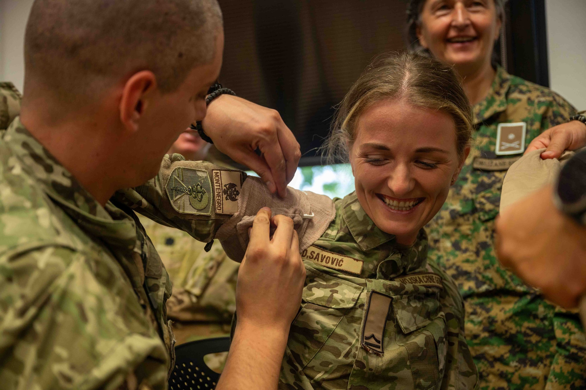 Services members from Montenegro and Bosnia apply a tourniquet during the European Role 1 Development week at Ramstein Air Base, Germany, Sept. 16, 2024.