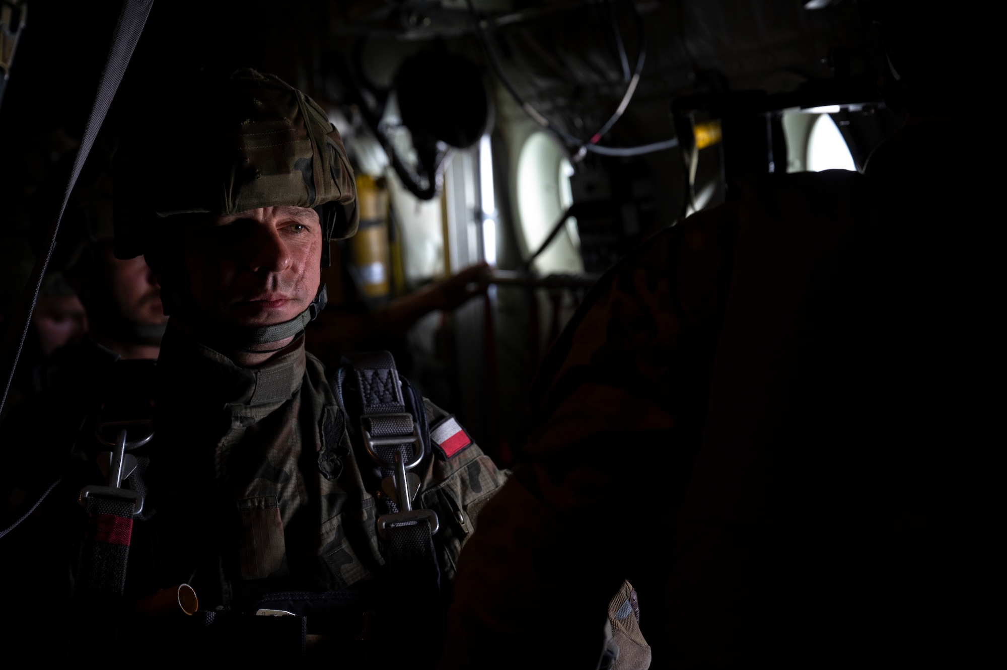 A man prepares to jump out of an airplane