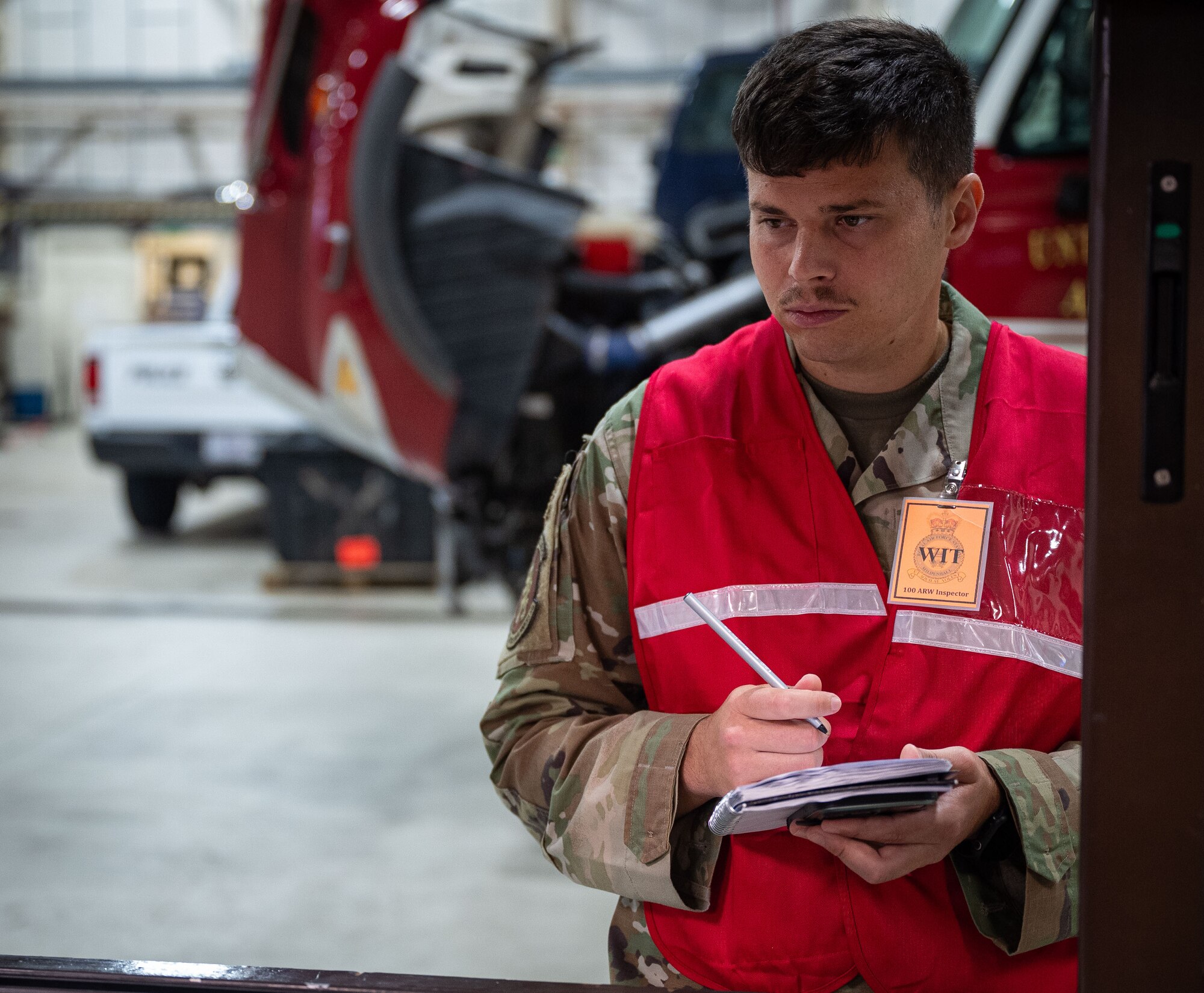 U.S. Air Force Tech. Sgt. John Atterson, 100th Logistics Readiness Squadron quality assurance manager, observes an exercise scenario during a base readiness exercise at Royal Air Force Mildenhall, England, Sept. 20, 2024.