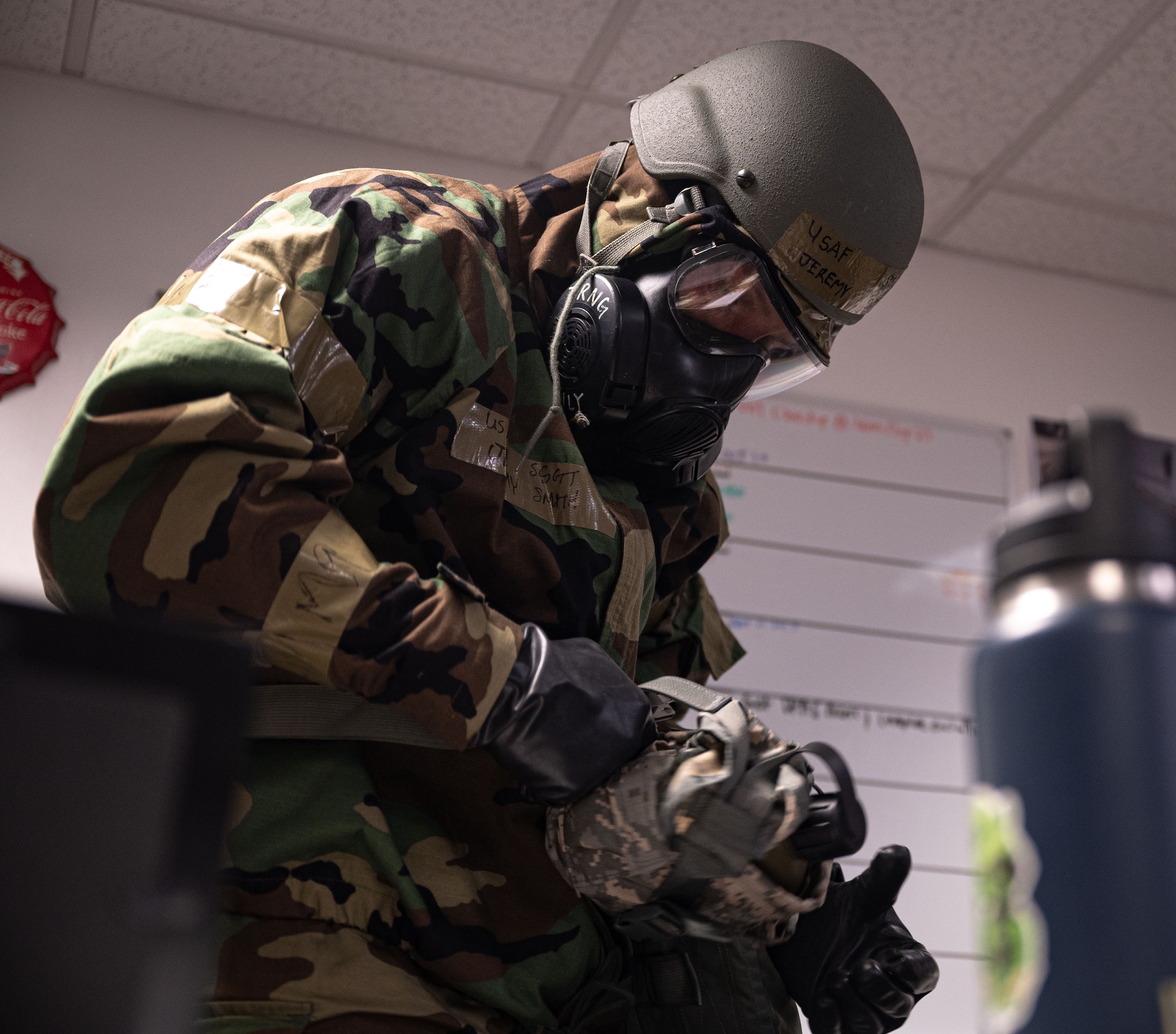 U.S. Air Force Staff Sgt. Jeremy Smith, 100th Logistics Readiness Squadron Vehicle Management chief of General Purpose and Customer Service center, positions his canteen on his web belt during a base readiness exercise at Royal Air Force Mildenhall, England, Sept. 20, 2024.