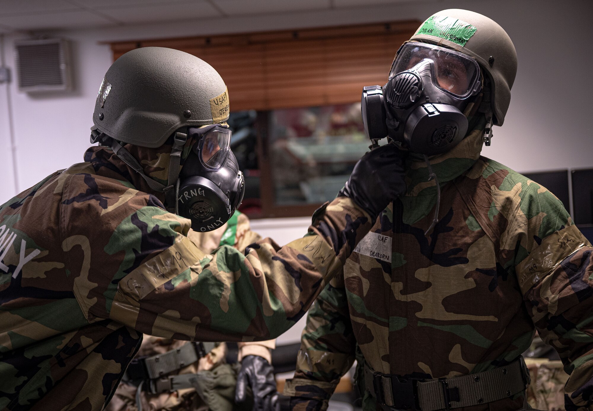 U.S. Airmen from the 100th Logistics Readiness Squadron conduct “buddy-checks” during a base readiness exercise at Royal Air Force Mildenhall, England, Sept. 20, 2024.