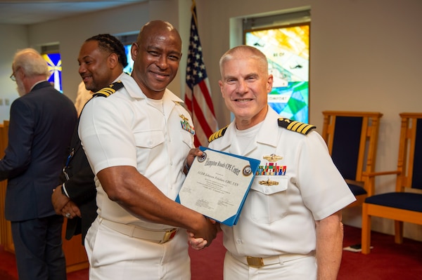 240920-N-MT837-1046 PORTSMOUTH, Va. (Sept. 20, 2024) Navy chaplain Lt. Cmdr. Johnson Folahan, a graduate from the Pastoral Care Residency (PCR) program at Naval Medical Center Portsmouth (NMCP), poses for a photo with Capt. William Hlavin, the regional chaplain assigned to Naval Medical Forces Atlantic, on board Naval Support Activity (NSA) Hampton Roads - Portsmouth Annex, Sept. 20, 2024. The graduating Navy chaplains from NMCP include: Lt. Cmdr. Reggie Jones, who will serve at Expeditionary Medical Ship 3 (EMS 3) attached to NMRTC Fort Belvoir, Lt. Cmdr. Jeff Birch, who will be assigned to Expeditionary Medical Unit-4 (EMU 4) attached to Navy Medicine Readiness Training Command (NMRTC) Beaufort, Lt. Cmdr. Johnson Folahan heading to NMRTC Naples and Lt. Cmdr. Kevin Jackson at EMU 6 attached to NMRTC Bethesda. (U.S. Navy photo by Mass Commmunication Specialist 2nd Class Dylan Kinee)