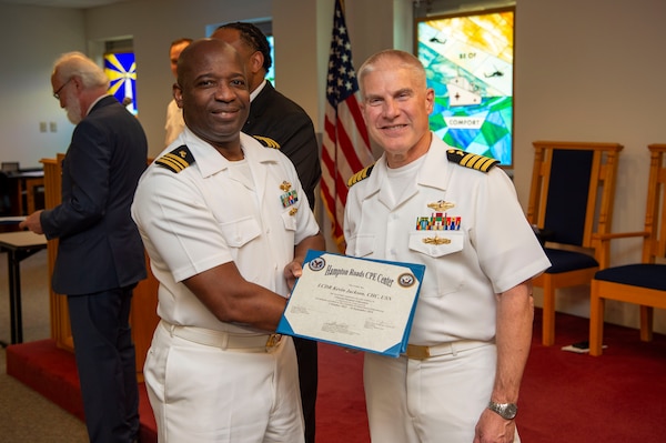 240920-N-MT837-1052 PORTSMOUTH, Va. (Sept. 20, 2024) Navy chaplain Lt. Cmdr. Kevin Jackson, a graduate from the Pastoral Care Residency (PCR) program at Naval Medical Center Portsmouth (NMCP), poses for a photo with Capt. William Hlavin, the regional chaplain assigned to Naval Medical Forces Atlantic, on board Naval Support Activity (NSA) Hampton Roads - Portsmouth Annex, Sept. 20, 2024. The graduating Navy chaplains from NMCP include: Lt. Cmdr. Reggie Jones, who will serve at Expeditionary Medical Ship 3 (EMS 3) attached to NMRTC Fort Belvoir, Lt. Cmdr. Jeff Birch, who will be assigned to Expeditionary Medical Unit-4 (EMU 4) attached to Navy Medicine Readiness Training Command (NMRTC) Beaufort, Lt. Cmdr. Johnson Folahan heading to NMRTC Naples and Lt. Cmdr. Kevin Jackson at EMU 6 attached to NMRTC Bethesda. (U.S. Navy photo by Mass Commmunication Specialist 2nd Class Dylan Kinee)