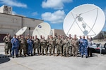 Participants of the Vulcan Guard Bolt-7 Space subject matter expert exchange receive a tour of the 109th Electromagnetic Warfare Squadron Sept. 16, 2024, at Joint Base Pearl Harbor-Hickam, Hawaii. The Hawaii Air National Guard hosted this multinational event to foster collaboration and enhance space capabilities.