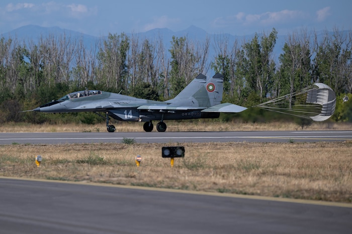 a plane lands on the taxiway