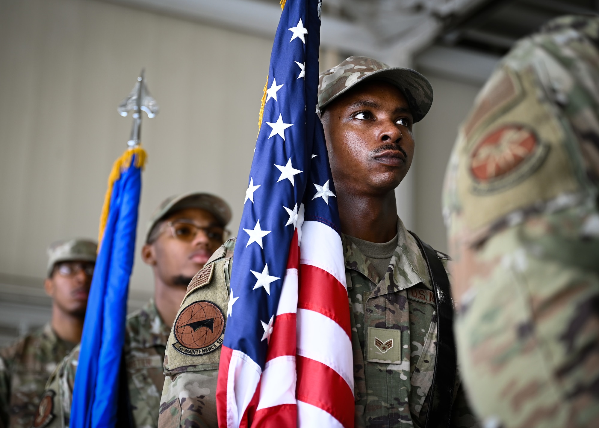 Honor guard Airmen stand in position before an assumption of command ceremony