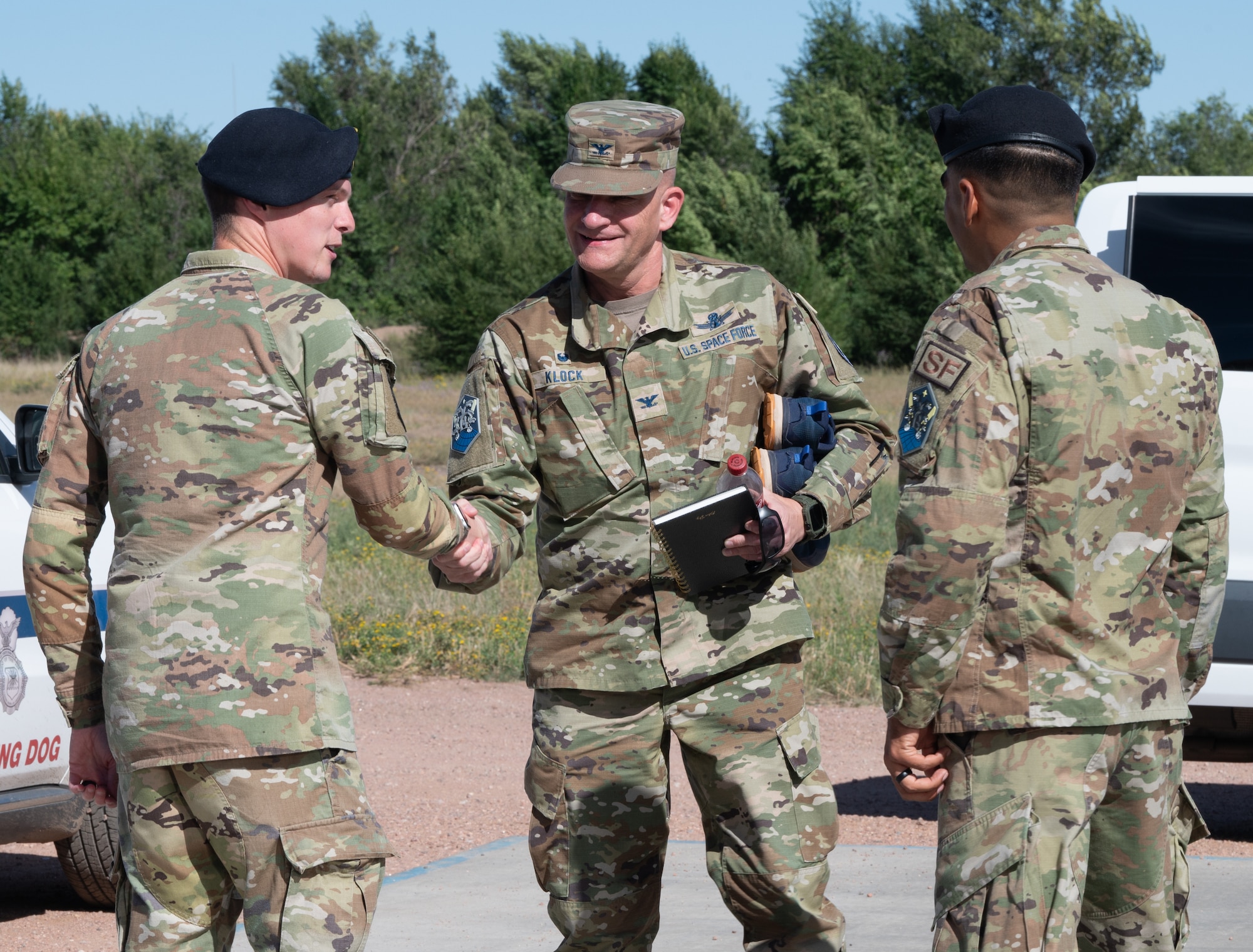 U.S. Space Force Col. Kenneth Klock, Space Base Delta 1 commander, arrives and greets members of the 21st Security Forces Squadron.