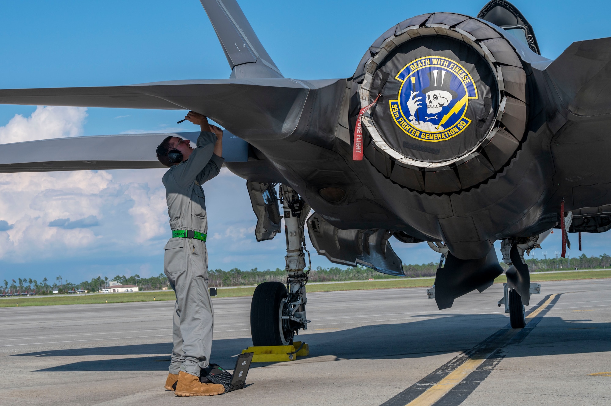 man fixes planes