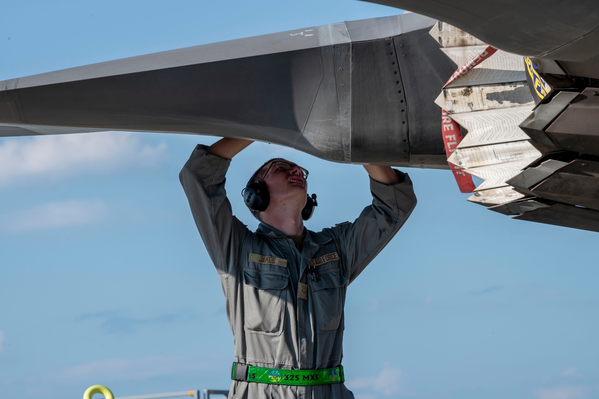 man fixes plane
