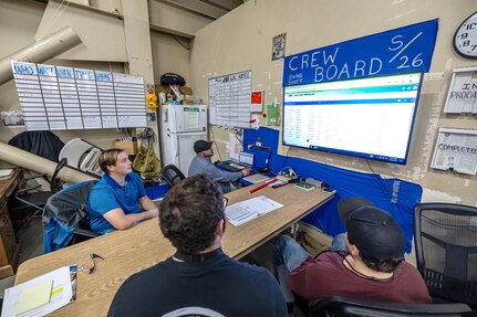 Seth Zwiefelhofer (left), digital transformation process manager, Code 900DX, Digital Transformation, goes over the new electronic crew board program with members of Shop 26, Welders, Sept. 19, 2024, in Building 1106 at Puget Sound Naval Shipyard & Intermediate Maintenance Facility in Bremerton, Washington. (U.S Navy photo by Jeb Fach)