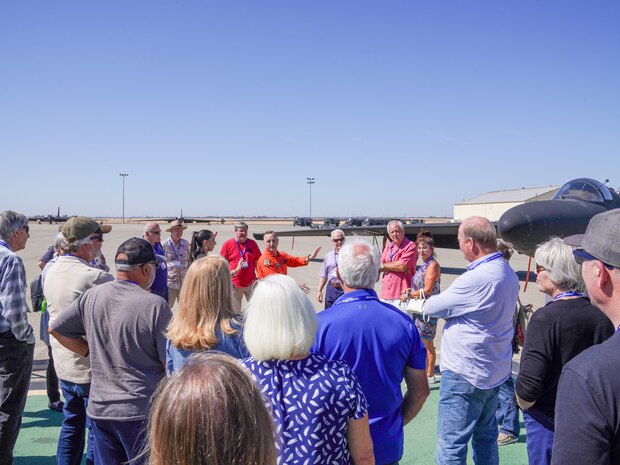 Cory Bartholomew, 1st Reconnaissance Wing U-2 instructor pilot, provides members of the Wheatland Union High School Class of 1974 a tour of the U-2 Dragon Lady at Beale Air Force Base, California, Sept. 20, 2024.
