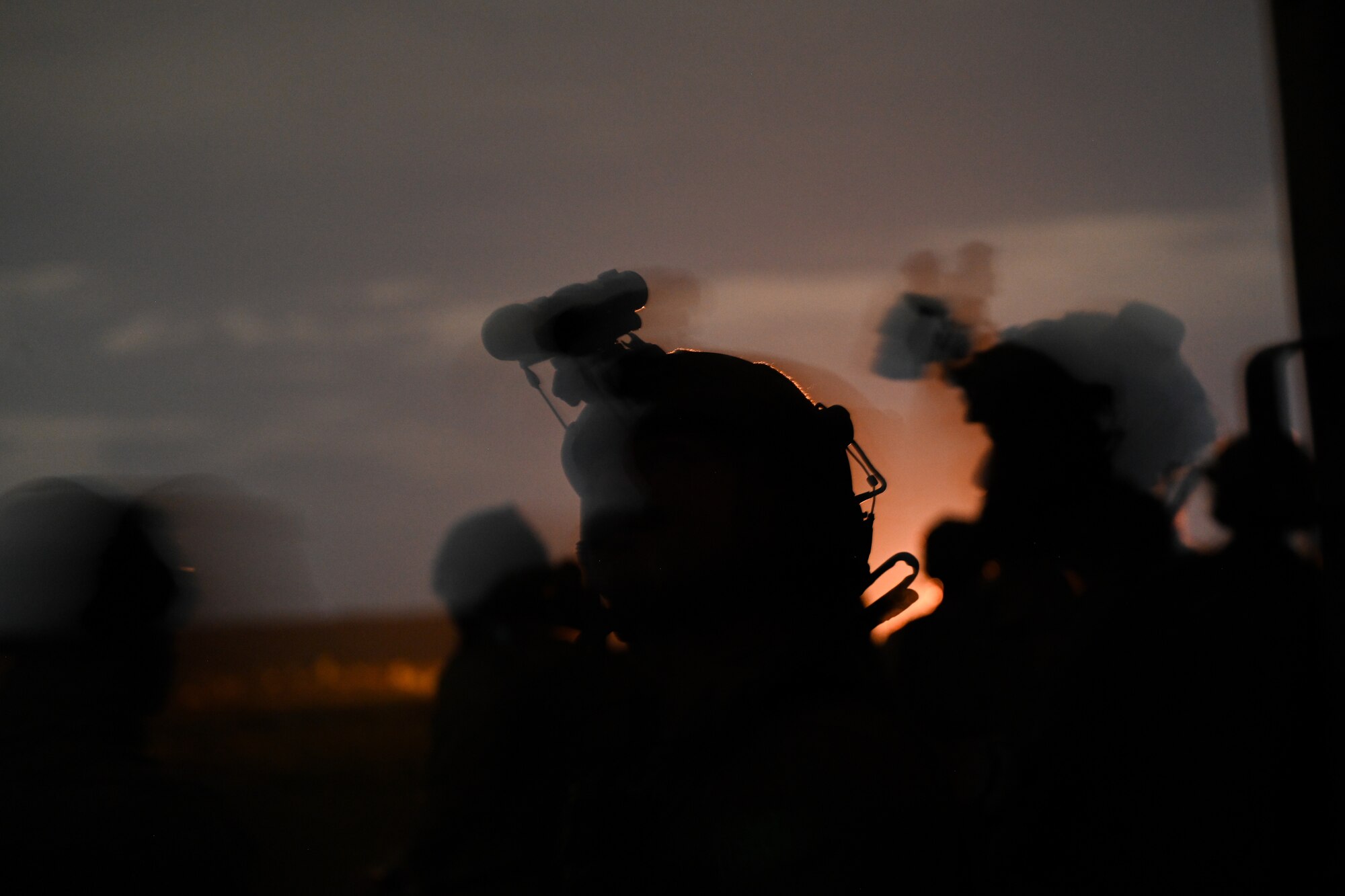 U.S. Air Force Tech. Sgt. Tyler Dugan, the 1st Special Operations Wing noncommissioned officer in charge of special missions planning, and members of the U.K. military watch as an AC-130J Ghostrider gunship fires on a target during Exercise Emerald Warrior Spiral at the Eglin Range near Hurlburt Field, Florida, Sept. 3, 2024.