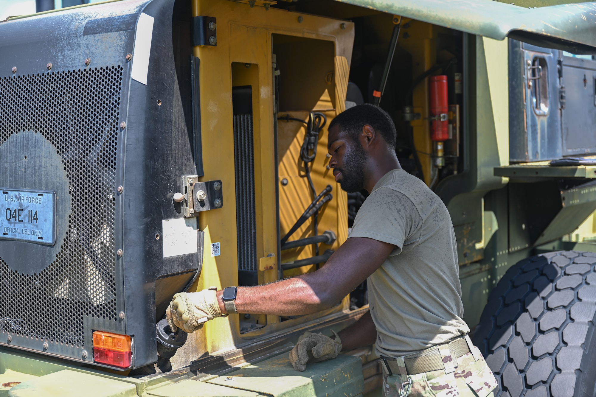 U.S. Air Force Airman 1st Class Sean Mitchell, a 1st Special Operations Wing ground transportation operator, performs a maintenance check on a forklift at Hurlburt Field, Florida, Sept. 18, 2024.