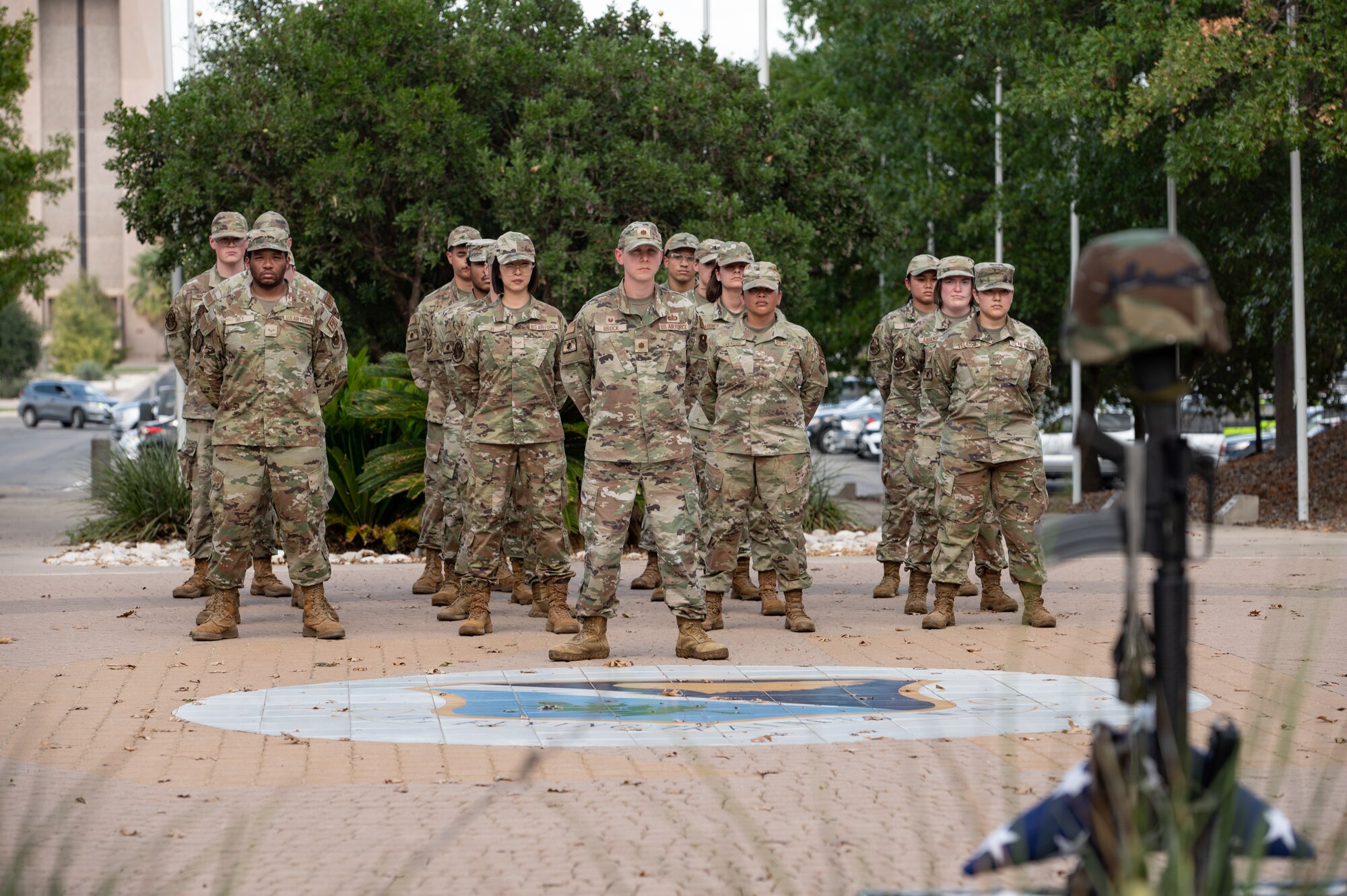 U.S. Air Force Airmen from the 47th Wing Staff Agency stand at parade rest during a Prisoners of War (POW) and Missing in Action (MIA) closing ceremony at Laughlin Air Force Base, Texas, Sept. 20, 2024. POW/MIA Recognition Day also honors the families of the missing, who continue to seek closure. (U.S. Air Force photo by Senior Airman Keira Rossman)