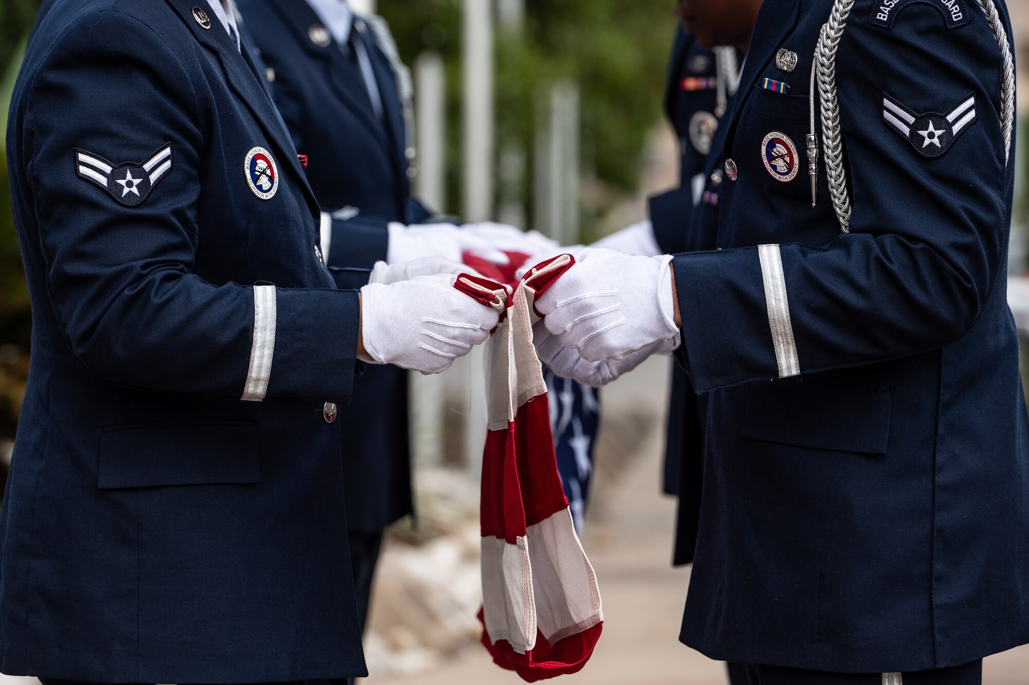 U.S. Air Force Airmen from the base Honor Guard team fold an American flag during a Prisoners of War (POW) and Missing in Action (MIA) closing ceremony at Laughlin Air Force Base, Texas, Sept. 20, 2024. The observance of POW/MIA Recognition Day aims to educate future generations about the sacrifices made by those who served. (U.S. Air Force photo by Senior Airman Keira Rossman)