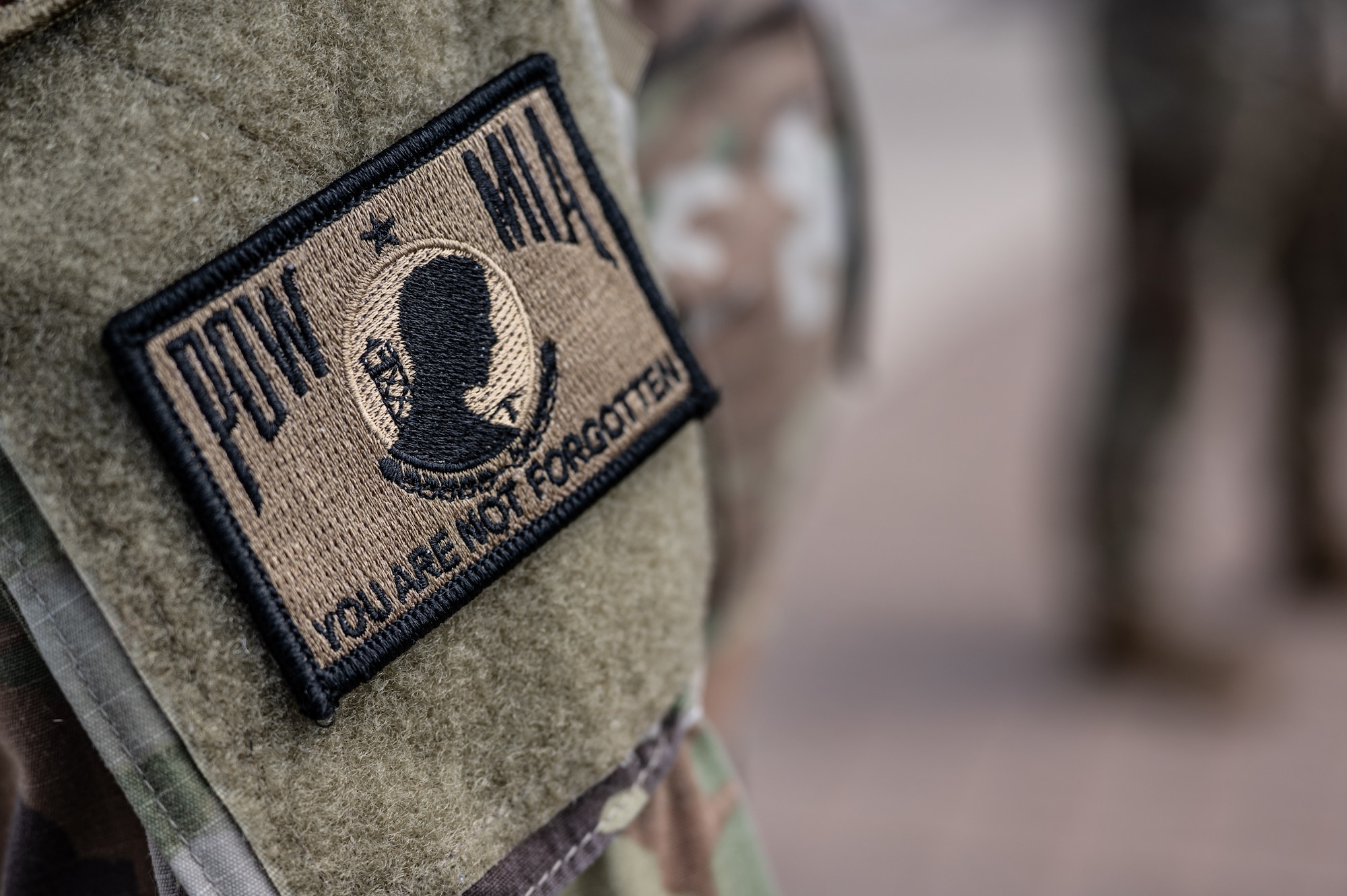 A U.S. Air Force Prisoner of War (POW) and Missing in Action (MIA) patch worn by a participant of the POW and MIA closing ceremony at Laughlin Air Force Base, Texas, Sept. 20, 2024. The first POW/MIA Recognition Day was observed in 1979 after a proclamation by President Jimmy Carter. (U.S. Air Force photo by Senior Airman Keira Rossman)