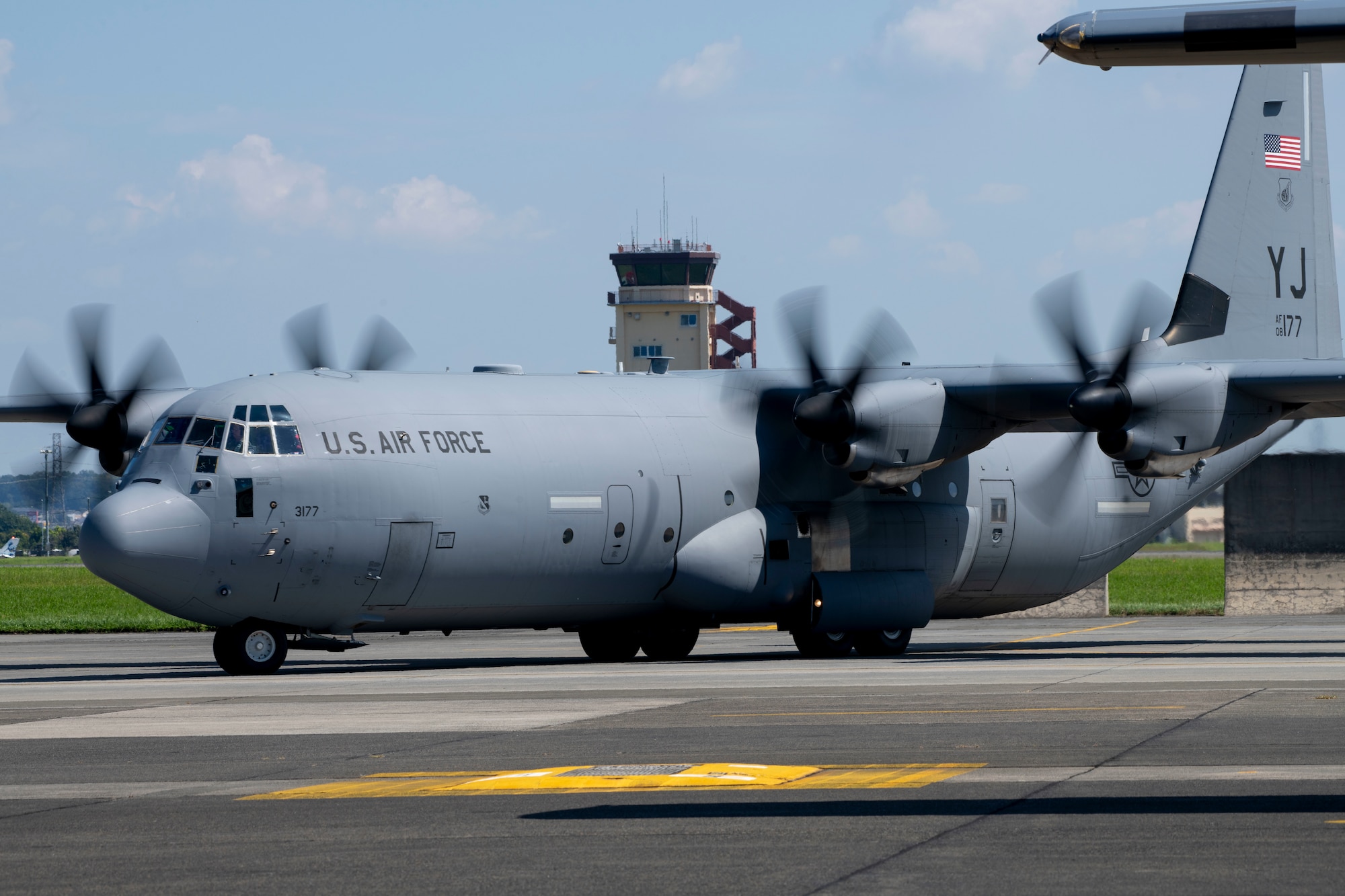 A C-130J Super Hercules taxis across the flight line.