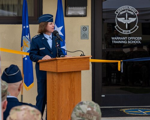 U.S. Air Force Lt. Gen. Andrea Tullos, Commander and President of Air University, speaks at the Warrant Officer Training School ribbon cutting ceremony at Maxwell Air Force Base, Alabama, Sept. 25, 2024. The reintroduction of the Warrant Officer Corps career path intends to address critical operational needs, while maintaining highly perishable skills, and simultaneously leveraging the unique expertise and capabilities of warrant officers. (U.S. Air Force photo by Senior Airman Evan Lichtenhan)