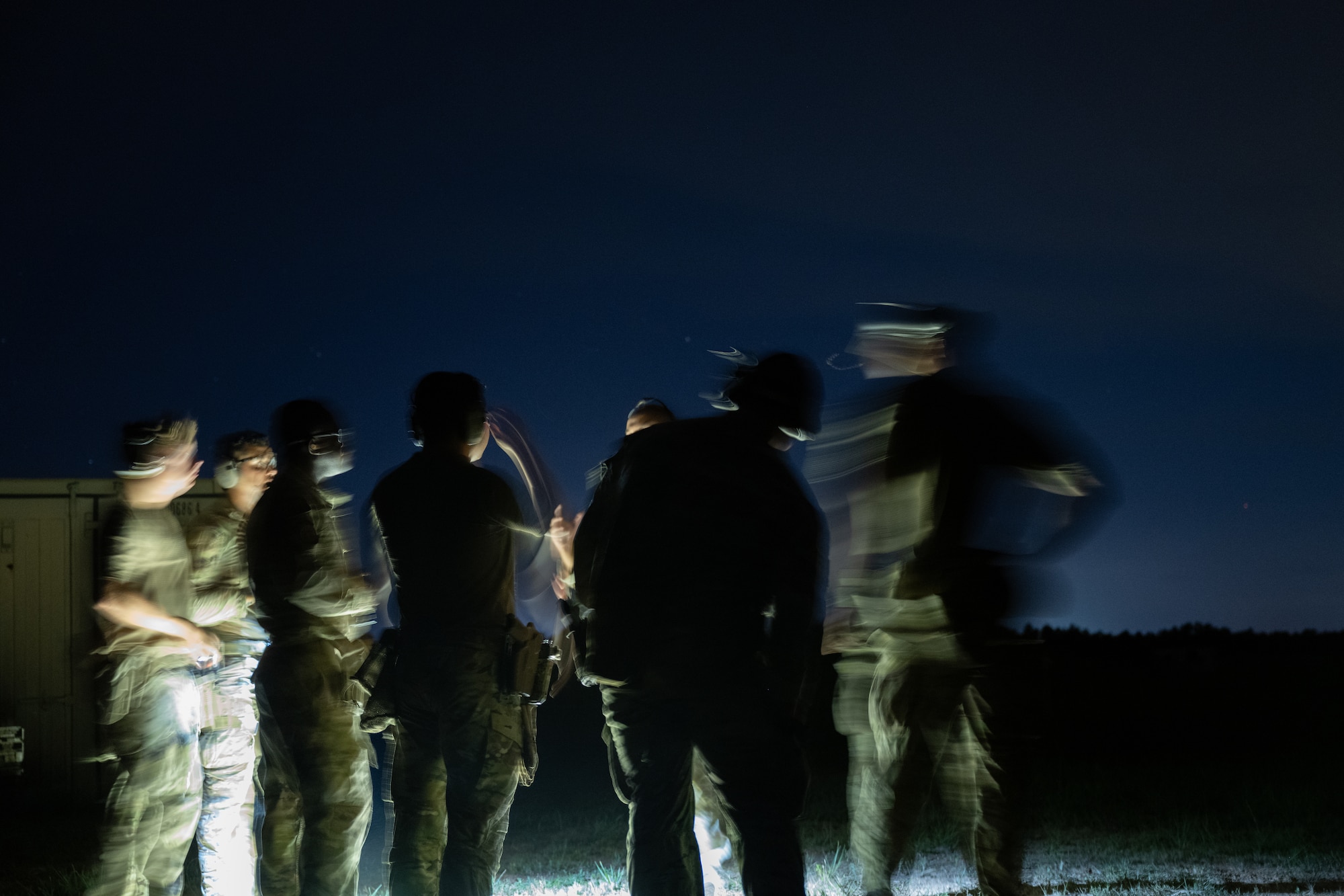 U.S. Airmen assigned to the 1st Special Operations Support Squadron Mission Sustainment Team discuss details of a night range exercise at Eglin Air Force Base, Florida, Aug. 27, 2024.