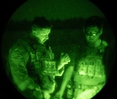 U.S. Airmen assigned to the 1st Special Operations Support Squadron Mission Sustainment Team discuss details of a night range exercise at Eglin Air Force Base, Florida, Aug. 27, 2024.