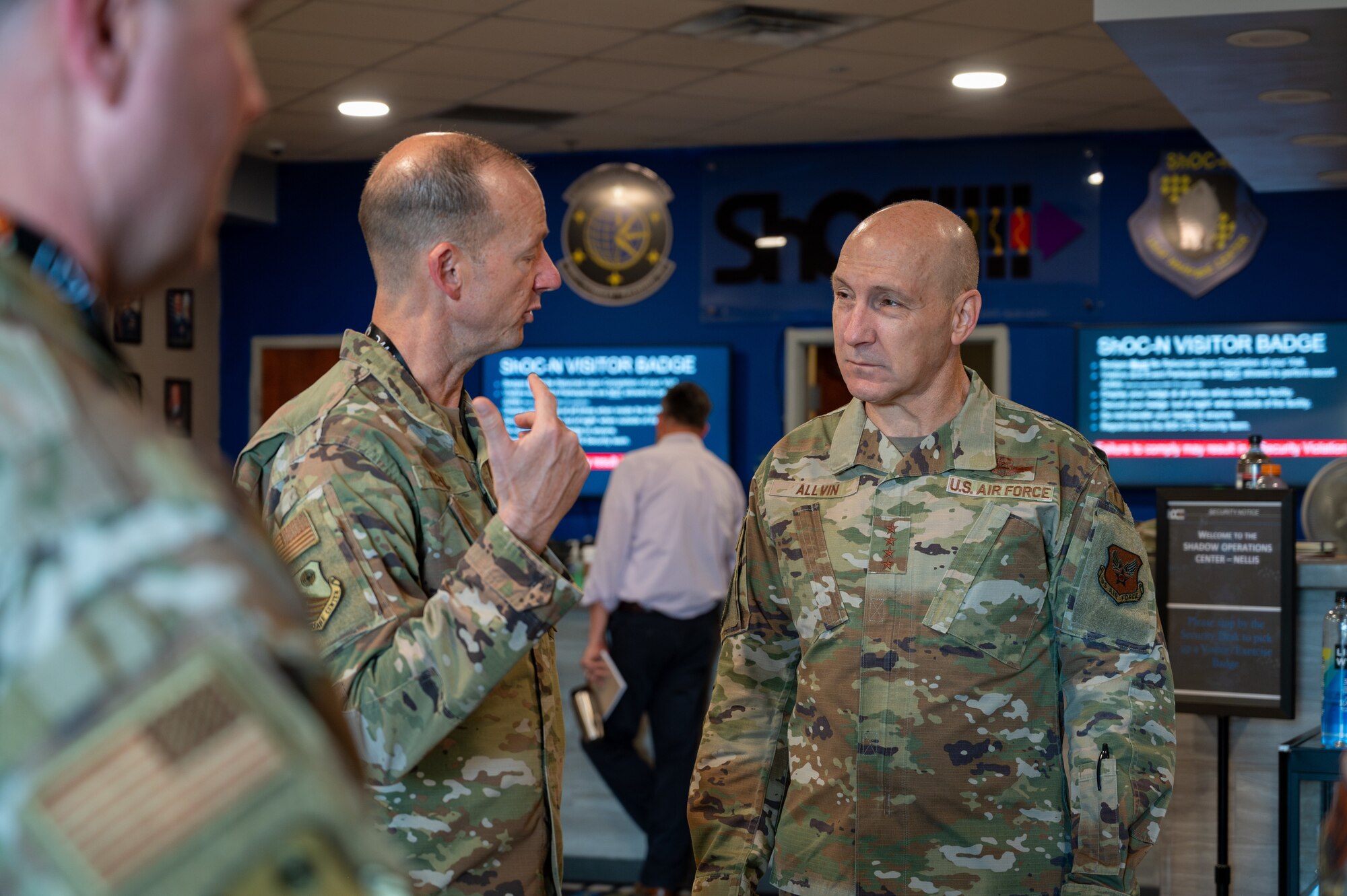 photo of two U.S. Air Force Airmen talking