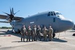 From left, U.S. Air Force Master Sgt. Noah Polcar, loadmaster, 154th Training Squadron, Maj. Robert Stephenson, pilot, 154th TRS, Maj. Eric Zane, pilot, 154th TRS, Master Sgt. Levi Sortomme, loadmaster, 154th TRS, Staff Sgt. Dakoda Baker, crew chief, 189th Maintenance Group, and Master Sgt. Jacob Shaulis, crew chief, 189th MXG, in front of the second of the first two C-130J Super Hercules aircraft received by the 189th AW after initial arrival at Little Rock AFB, Arkansas, Sept. 18, 2024.