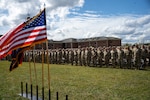 Soldiers with the 38th Infantry Division's headquarters battalion stand for an invocation during their departure ceremony at Camp Atterbury near Edinburgh, Indiana, Sept. 25, 2024. The Citizen-Soldiers will serve their country overseas in the Middle East supporting Operation Spartan Shield.
