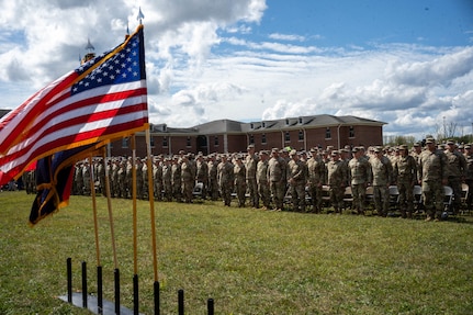 Soldiers with the 38th Infantry Division's headquarters battalion stand for an invocation during their departure ceremony at Camp Atterbury near Edinburgh, Indiana, Sept. 25, 2024. The Citizen-Soldiers will serve their country overseas in the Middle East supporting Operation Spartan Shield.