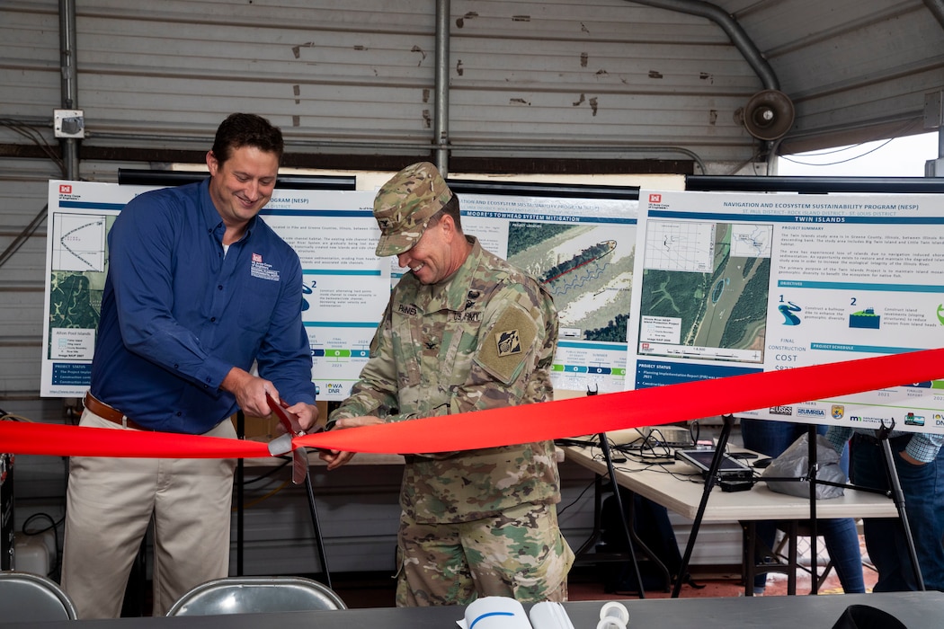 Shane Simmons and Col. Andy Pannier cut the ribbon for NESP island dedication.