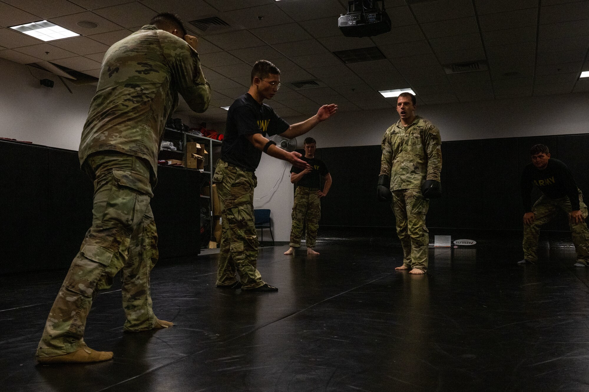 Service members stand before drill