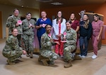 Members of the 30th Medical Group pose for photo in celebration of the semi-annual Pap-A-Thon at Vandenberg Space Force Base.