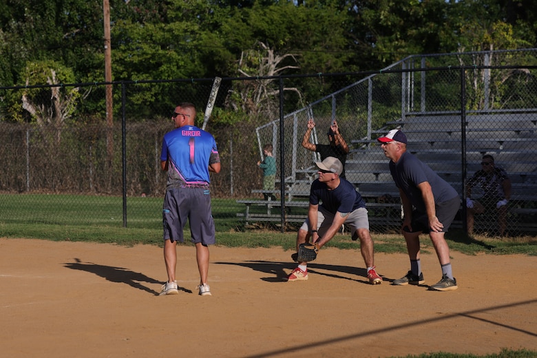 MSgt. Giroir plays softball, pitches, catches, and hits