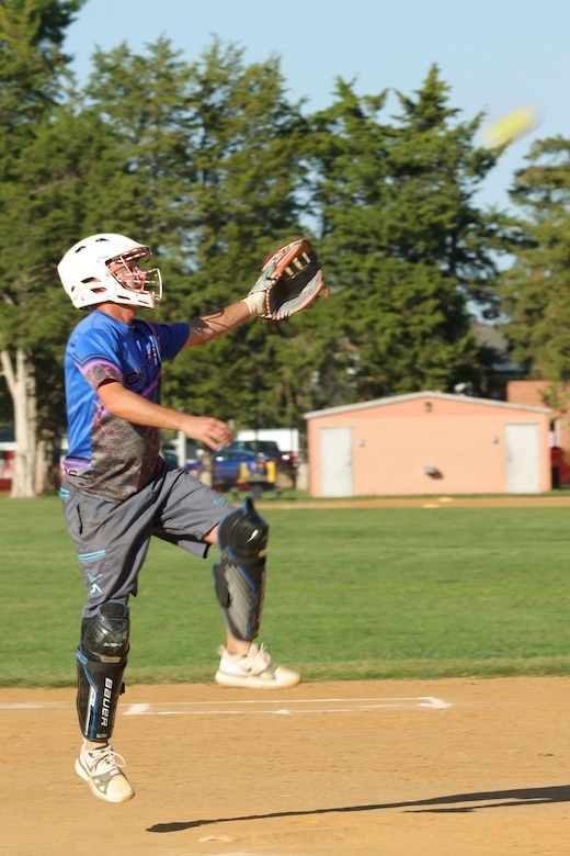 MSgt. Giroir plays softball, pitches, catches, and hits