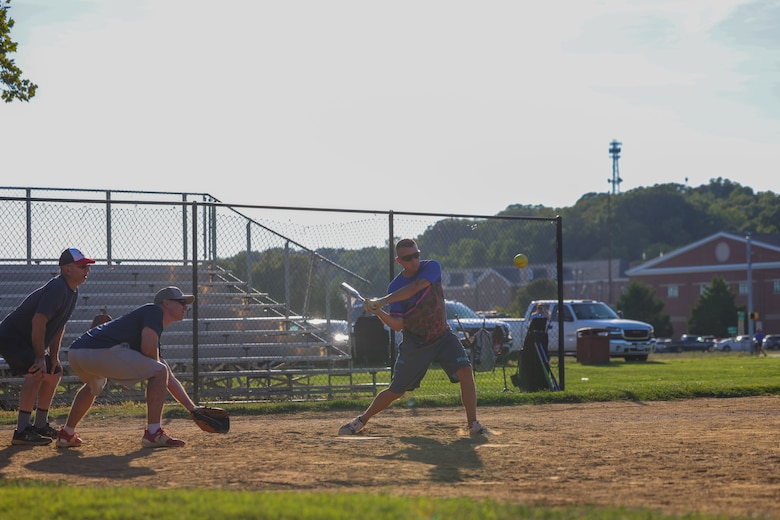 MSgt. Giroir plays softball, pitches, catches, and hits