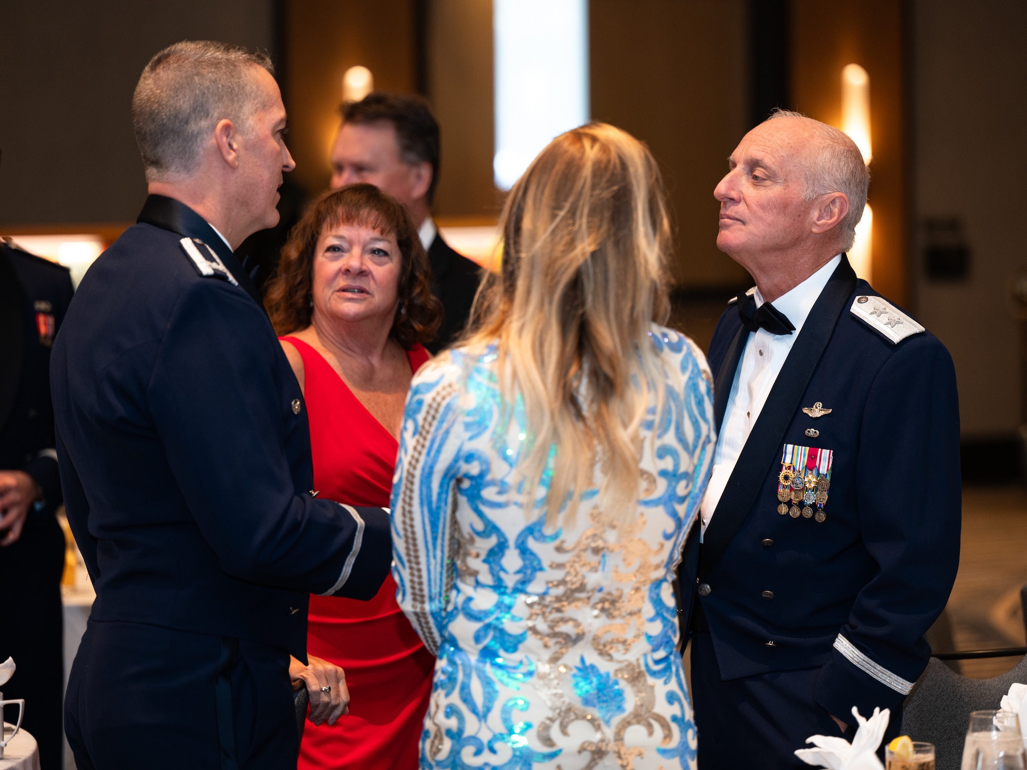 Dyess leadership speaks with U.S. Air Force Maj. Gen. Garrett Harencak, Air Force Recruiting Service commander, during the Dyess Air Force Ball at the DoubleTree by Hilton, Abilene, Texas, Sept. 21, 2024. Attendees of the ball were celebrating the Air Force’s 77th anniversary. (U.S. Air Force photo by Airman 1st Class Jade M. Caldwell)