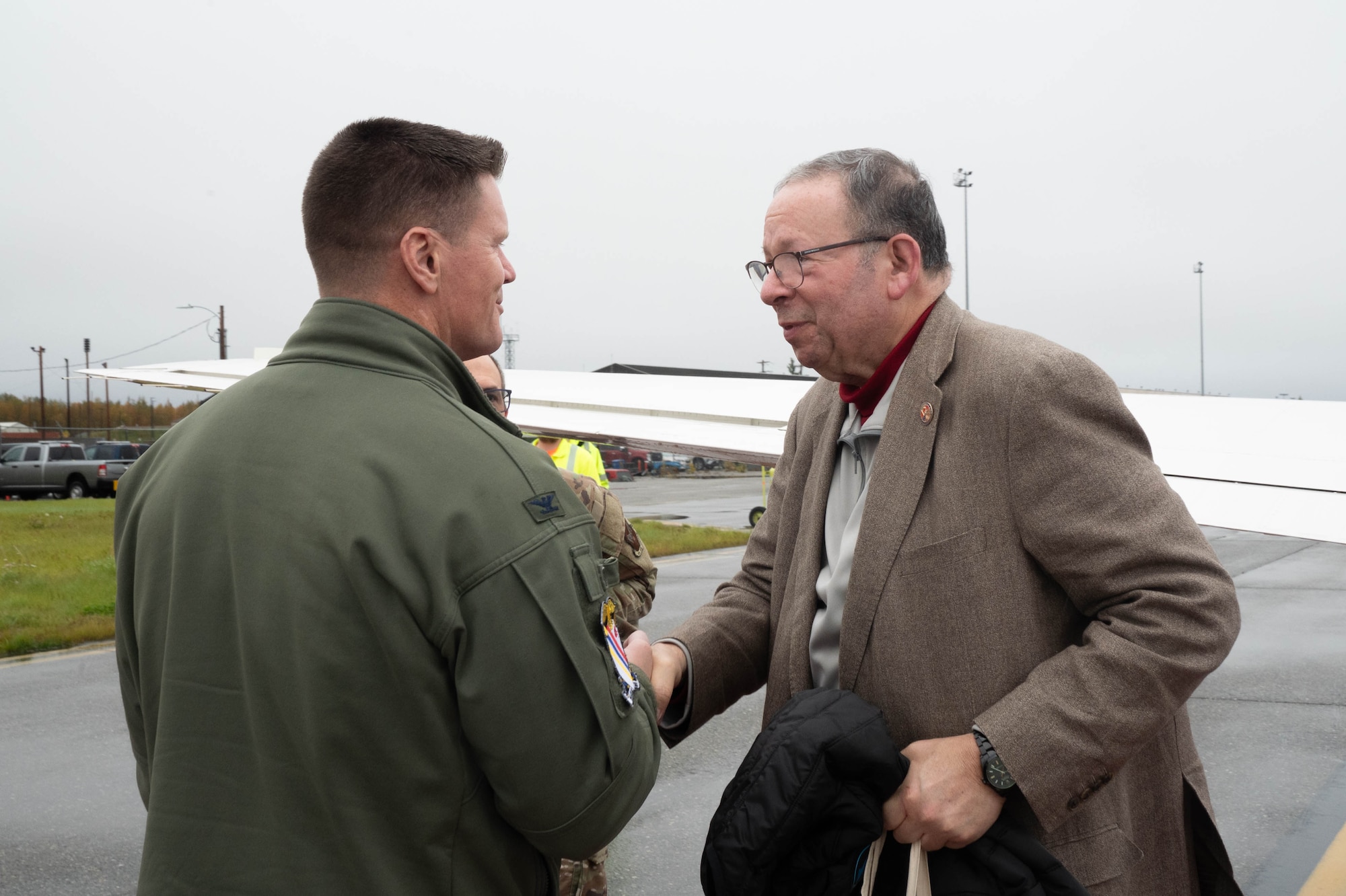 U.S. Ambassador to Canada David L. Cohen greets U.S. Air Force Col. Paul Townsend, 354th Fighter Wing commander, at Eielson Air Force Base, Alaska, Sept. 13, 2024.