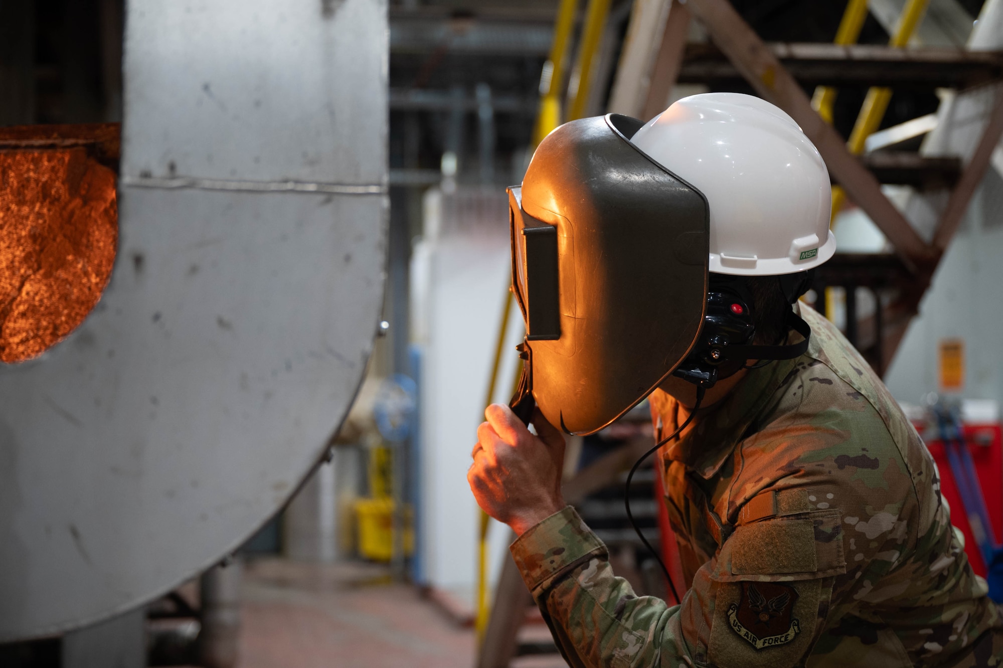 U.S. Air Force Col. Chadwick Sterr, U.S. Ambassador to Canada defense attaché, observes a furnace at the Central Heat and Power Plant during a tour at Eielson Air Force Base, Alaska, Sept. 13, 2024.