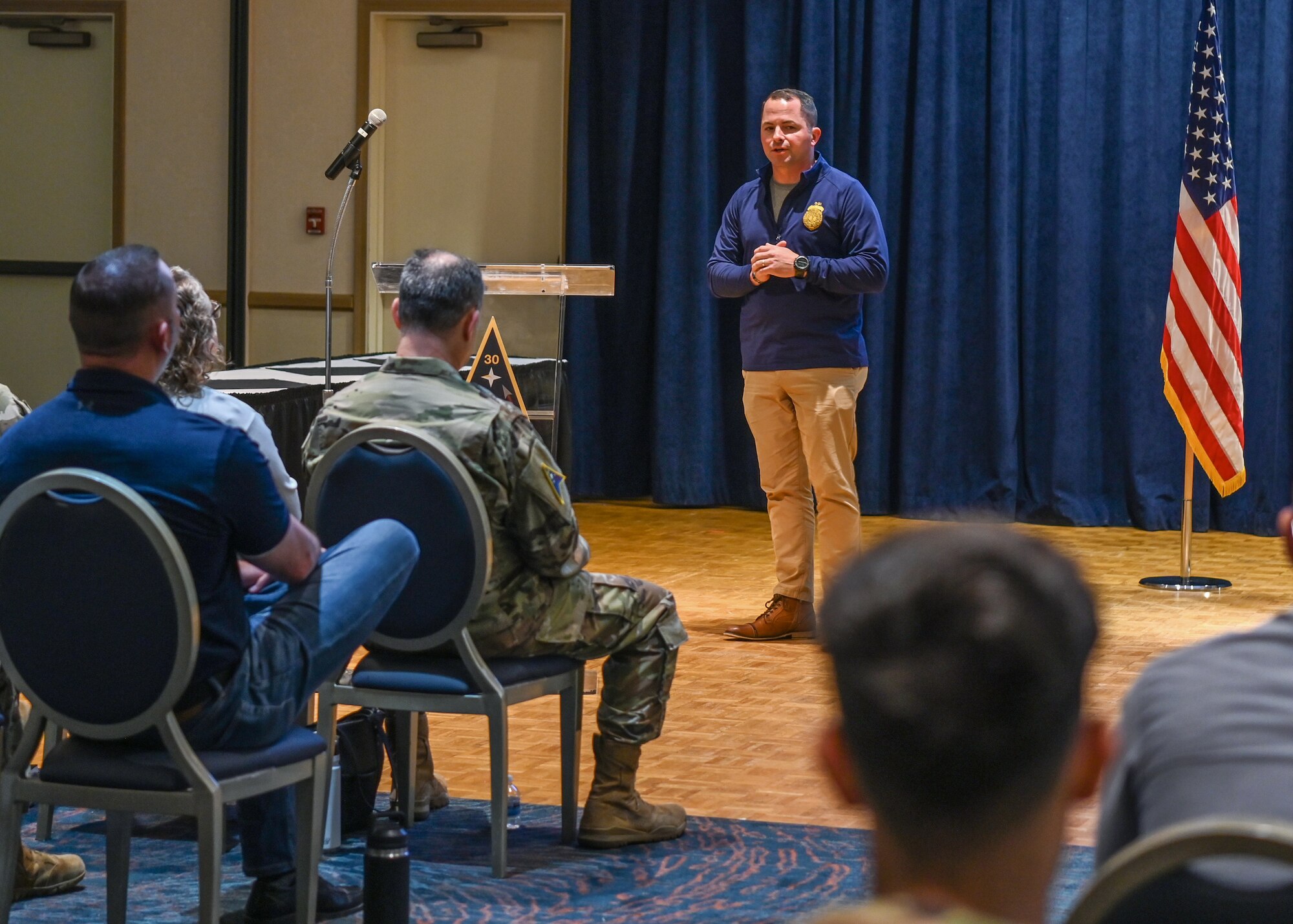 Office of Special Investigations detachment 804 commander, speaks to Guardians, Airmen and government civilians during an all call at Vandenberg Space Force Base.