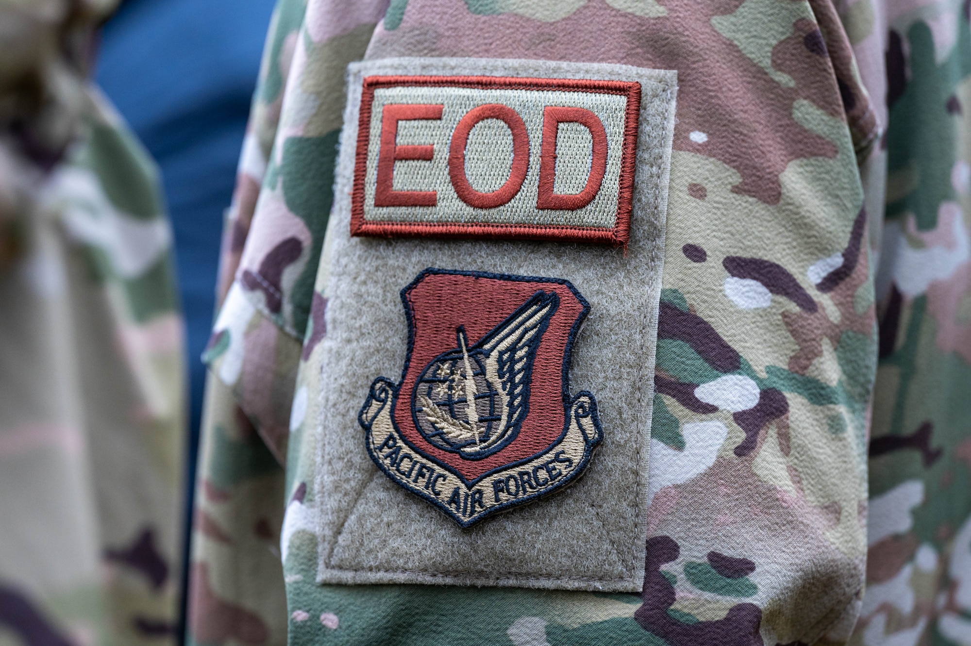 A U.S. Air Force Airman, assigned to the 354th Civil Engineering Squadron explosive ordnance disposal flight, wears an EOD duty identifier patch and a Pacific Air Forces patch at Eielson Air Force Base, Alaska, Sept. 20, 2024.