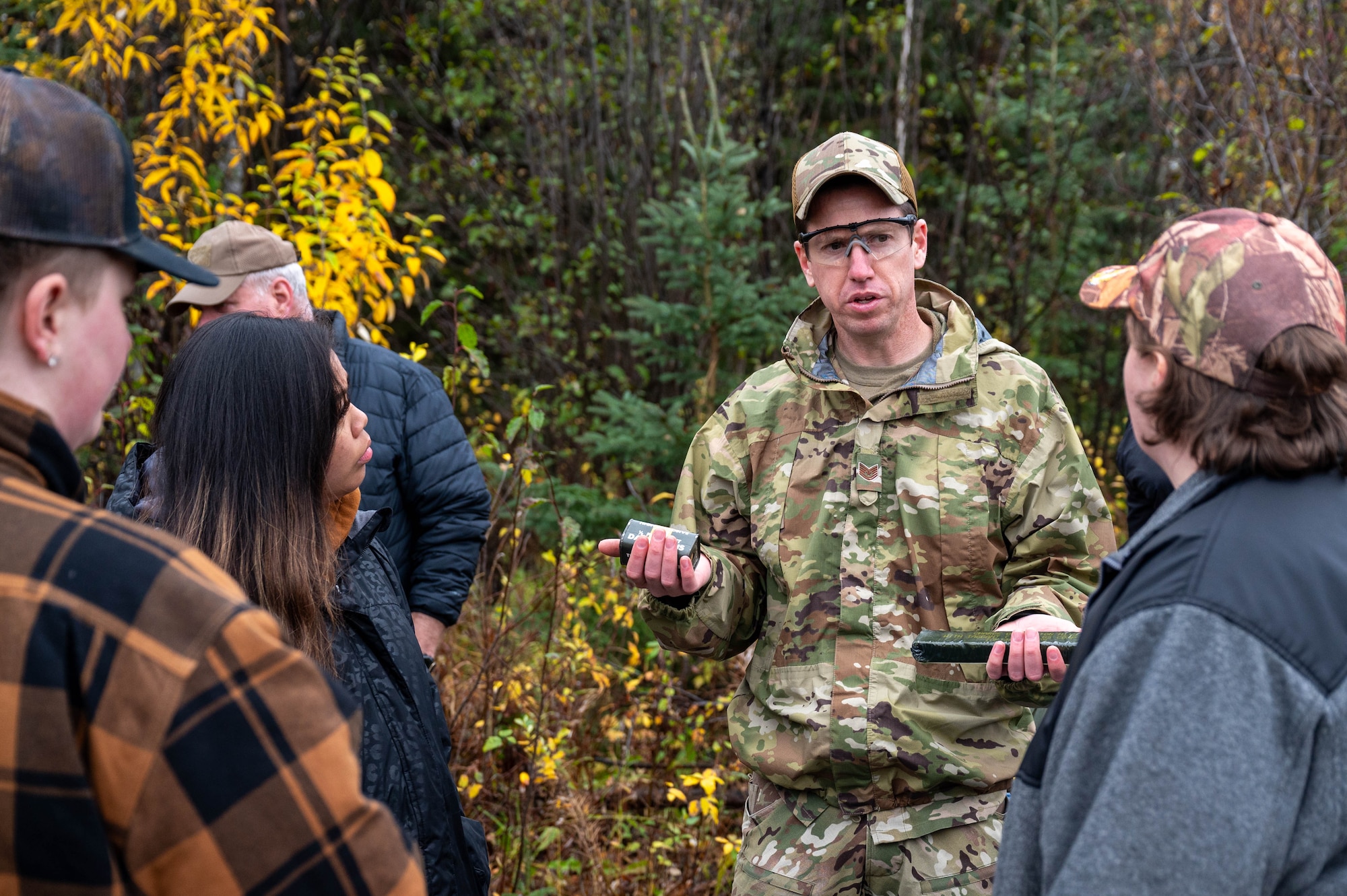 U.S. Air Force Tech. Sgt. Adam Ray, 354th Civil Engineering Squadron explosive ordnance disposal logistics section chief, explains the differences and similarities between TNT and C-4 at Eielson Air Force Base, Alaska, Sept. 20, 2024.