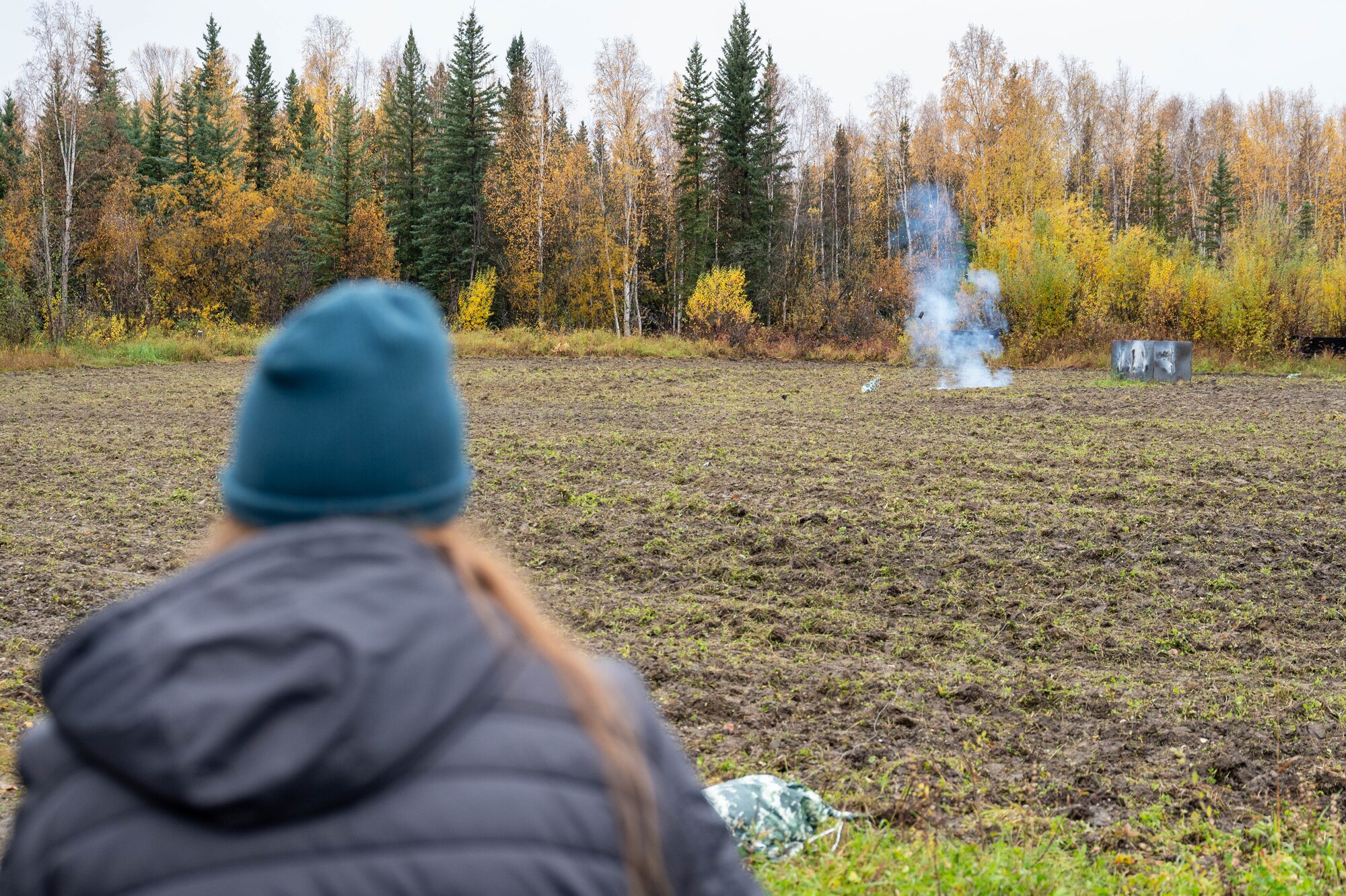 A Transportation Security Administration agent observes the aftermath of a controlled explosion at Eielson Air Force Base, Alaska, Sept. 20, 2024.