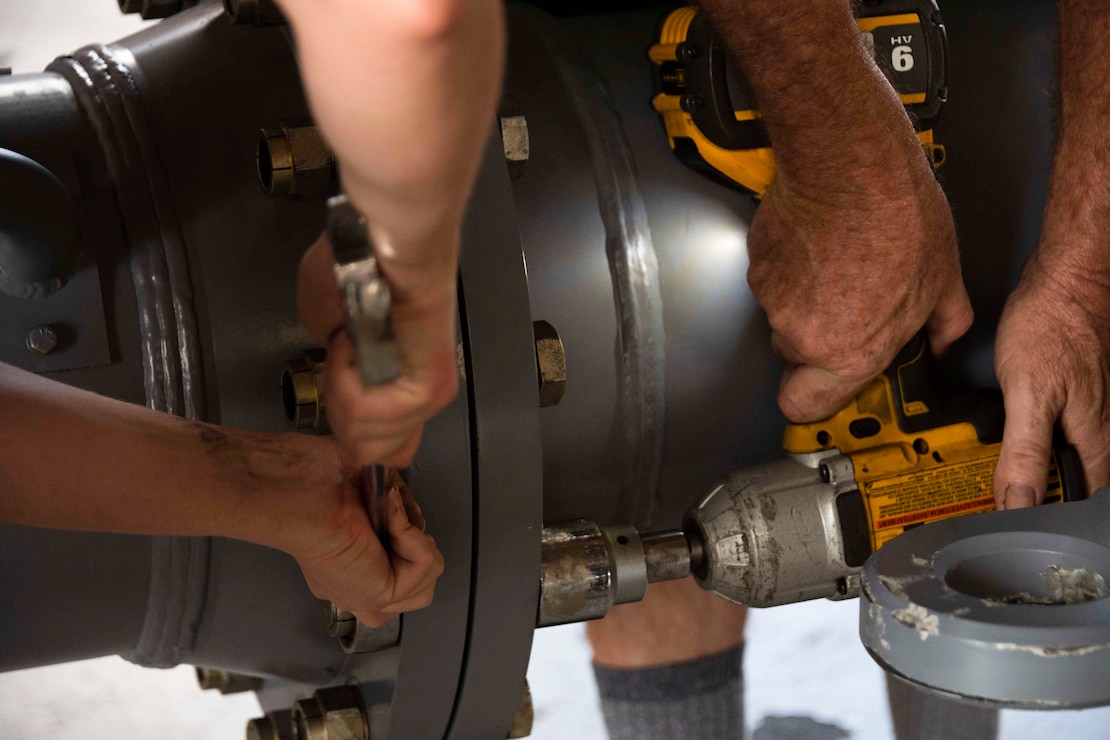 From left, a U.S. Airman from the 307th Maintenance Squadron and a U.S. Air Force civilian employee assemble a B-52 Stratofortress towbar prototype at Barksdale Air Force Base, Louisiana, Sept. 10, 2024. The individuals working on the towbar helped demonstrate the prototype’s capabilities, which include reduced assembly time and a smaller footprint than the current towbar. (U.S. Air Force photo by Senior Master Sgt. Ted Daigle)