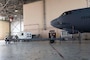 U.S. Airmen, assigned to the 2nd Maintenance Squadron, roll a B-52 Stratofortress towbar prototype into position during a demonstration at Barksdale Air Force Base, Louisiana, Sept. 10, 2024. The demonstration included assembly, transport and towing capabilities of the new prototype. If adopted, the new towbar could reduce readiness and mobility requirement problems inherent in current Agile Combat Employment efforts. (U.S. Air Force photo by Senior Master Sgt. Ted Daigle)