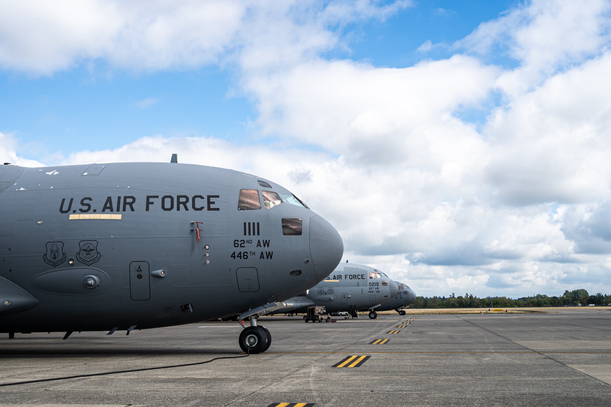 Three U.S. Air Force C-17 Globemaster IIIs sit on the McChord Field flightline at Joint Base Lewis-McChord, Washington, Sept. 18, 2024.