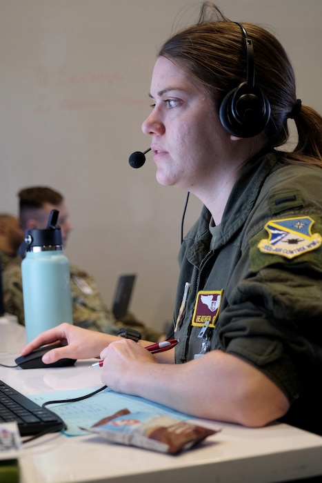 US Air Force Airman works on a computer